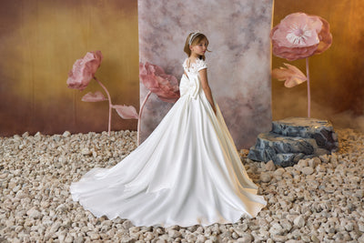 Heavenly Petals Communion Gown with oversized waistline bow and long train in the back